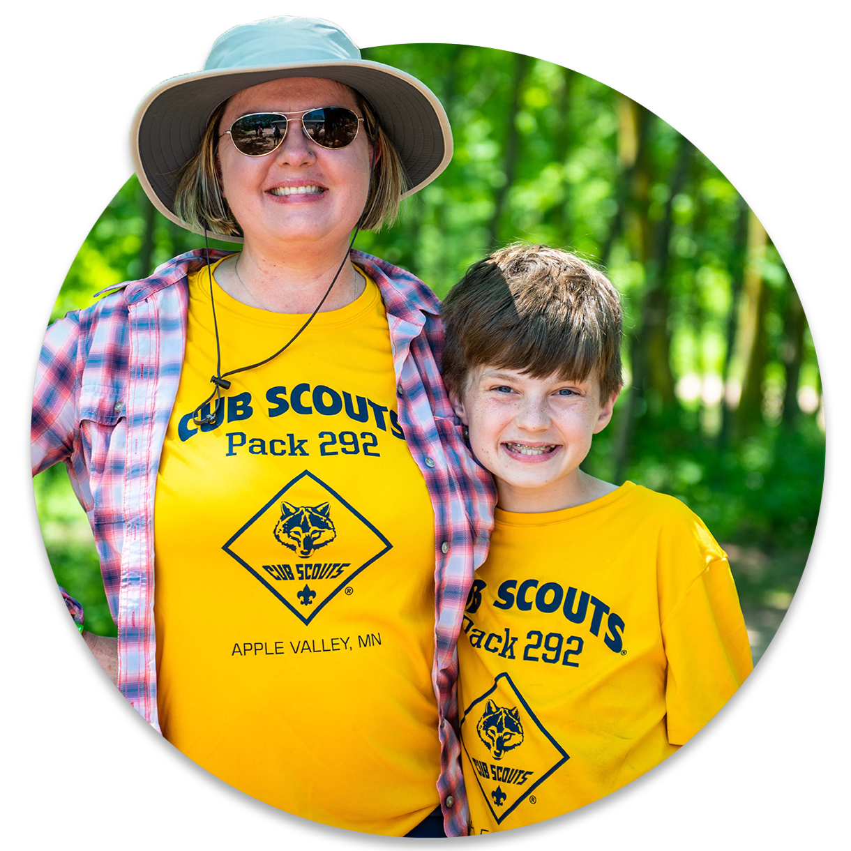 A mom and son are both wearing a t-shirt that says Cub Scout Pack 292